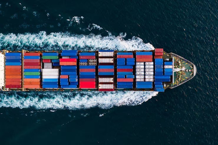 Aerial view of a loaded container ship at sea